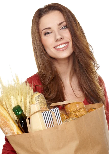 Fiatal nő, egy élelmiszerbolt táskányi kenyér gazdaság — Stock Fotó