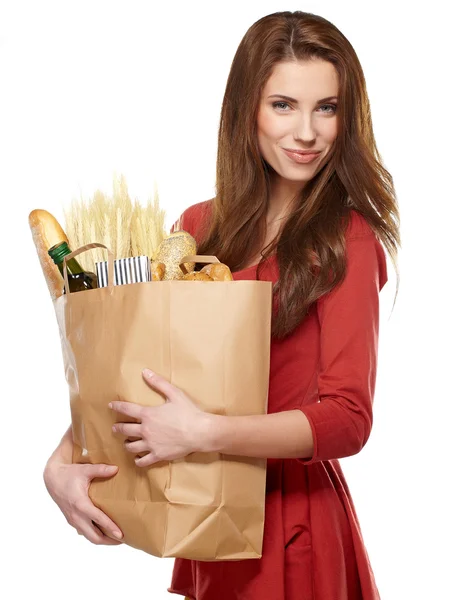 Young woman holding a grocery bag full of bread — Stock Photo, Image