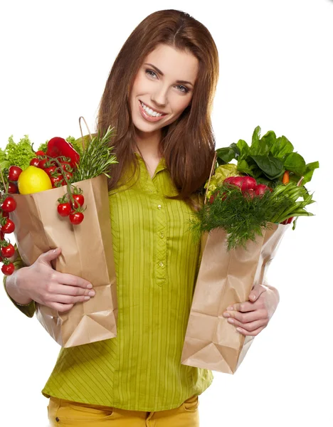 Chica sosteniendo una bolsa de comida — Foto de Stock