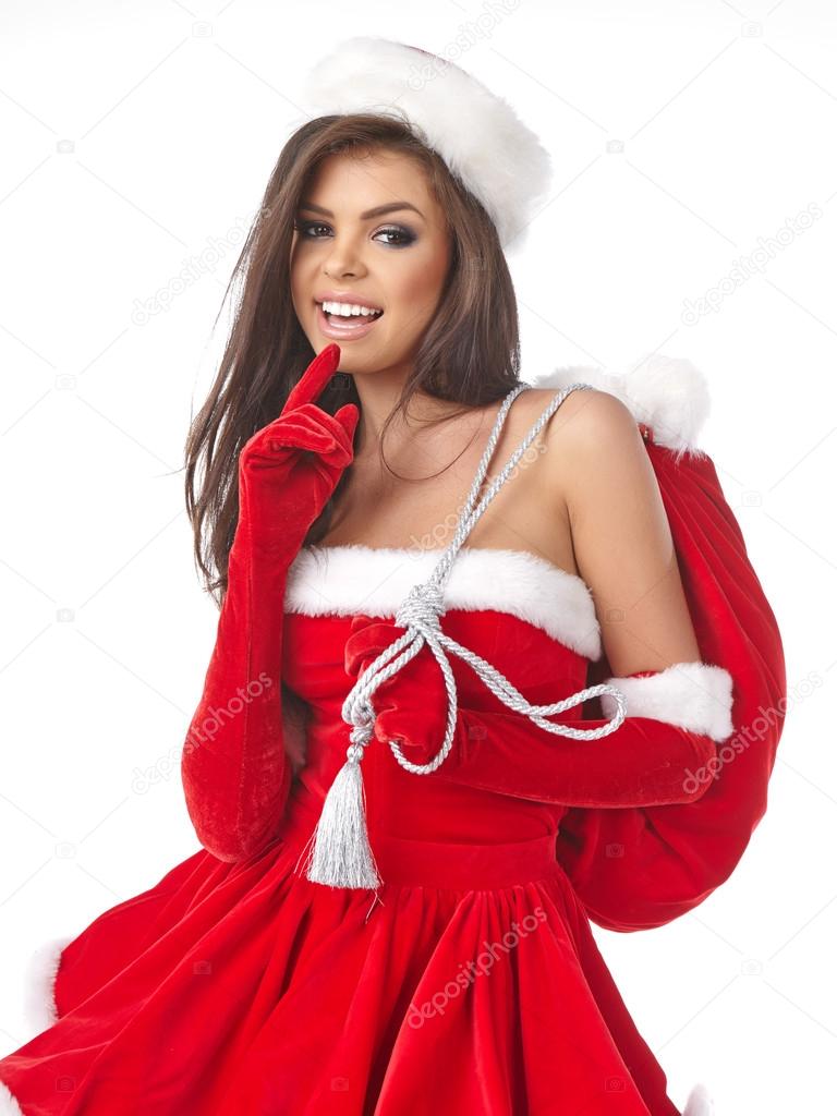 Christmas hispanic woman wearing a santa hat smiling