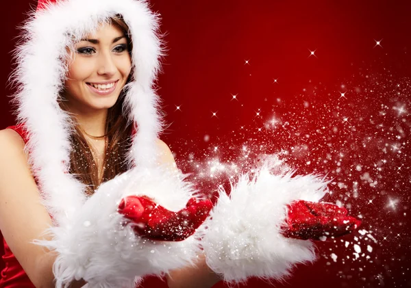 Foto de moda Christmas girl soplando nieve . —  Fotos de Stock