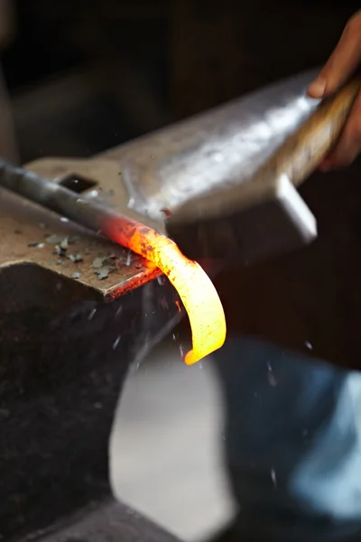 Incandescent element in the smithy on the anvil — Stock Photo, Image