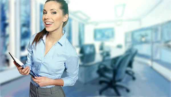 Young business woman in an office — Stock Photo, Image