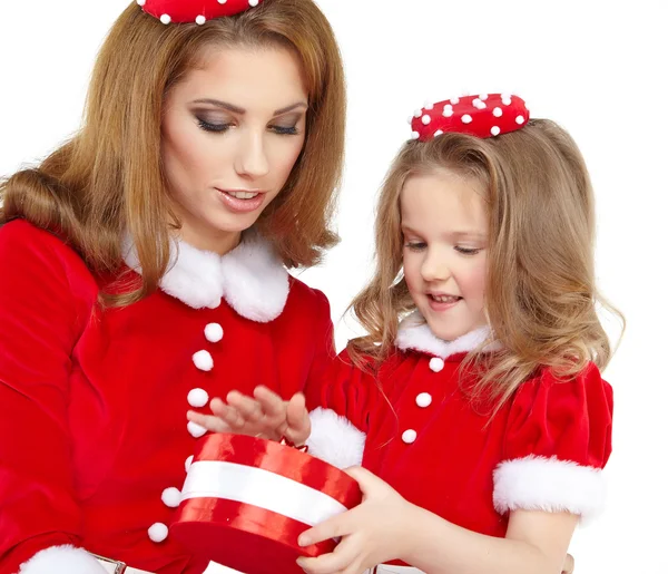 Woman and little girl wearing santa claus costume — Stock Photo, Image