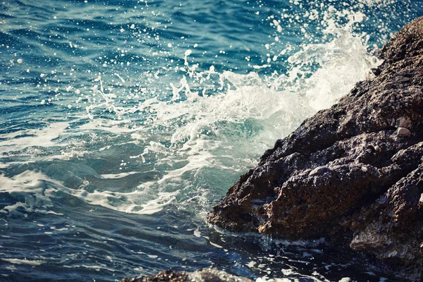 Stone breakwater with breaking waves — Stock Photo, Image