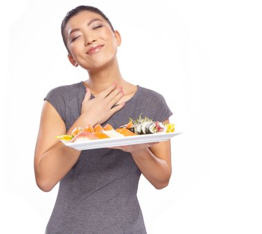 Woman holding a plate with sushi clipart