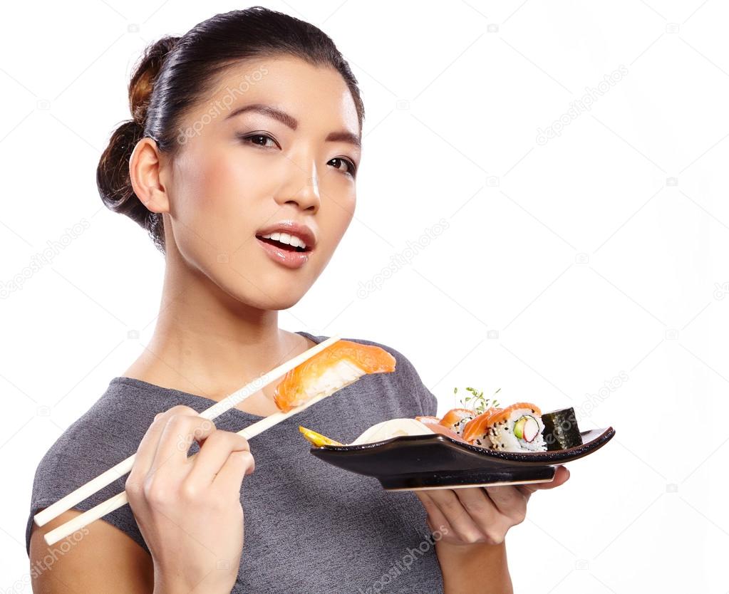 Woman eating sushi — Stock Photo © zoomteam 38690101