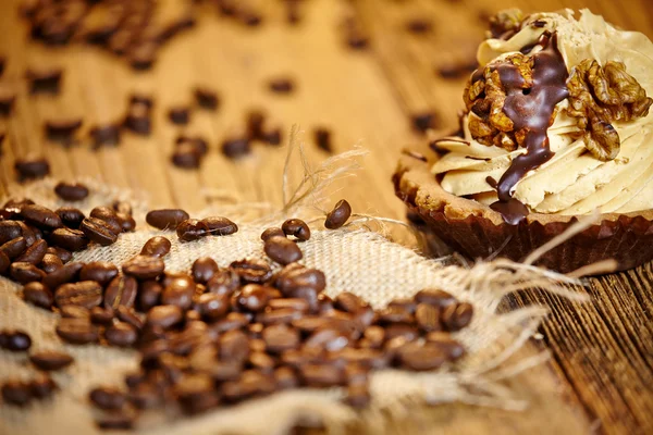 Chocolate cupcake on old wooden table — Stock Photo, Image