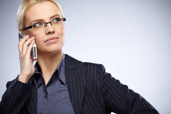 Businesswoman with cell phone — Stock Photo, Image