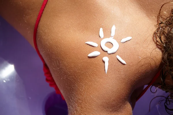 A sun made with suncream — Stock Photo, Image