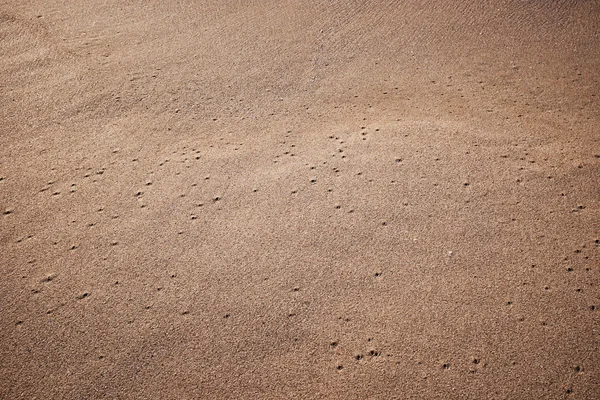 Текстура песка для фона — стоковое фото