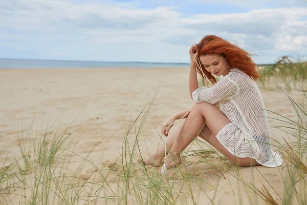 Smiling Vivacious Young Woman Relaxing Beach Sitting Sand Dunes Overlooking — Stock Photo, Image