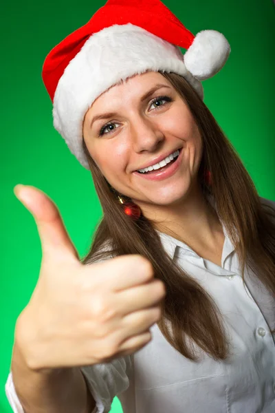 Cheerful girl in a Christmas hat — Stock Photo, Image