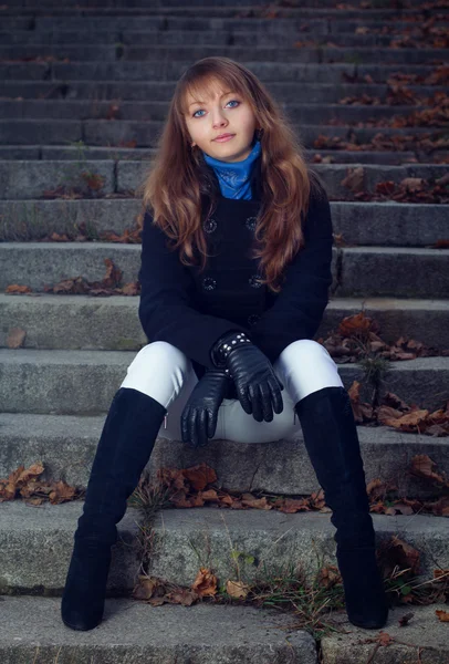 Portrait of a girl on the stairs — Stock Photo, Image