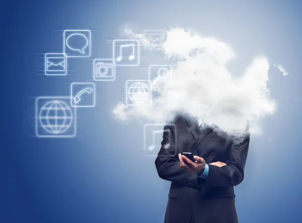 Empresario con teléfono y la nube con iconos de aplicaciones — Foto de Stock