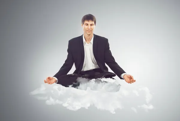 Empresario sentado en una nube —  Fotos de Stock