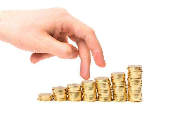 Coins column and fingers — Stock Photo, Image