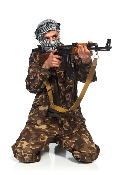 Terrorist with automatic gun on white background — Stock Photo, Image