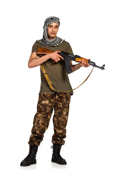 Terrorist with automatic gun on white background — Stock Photo, Image