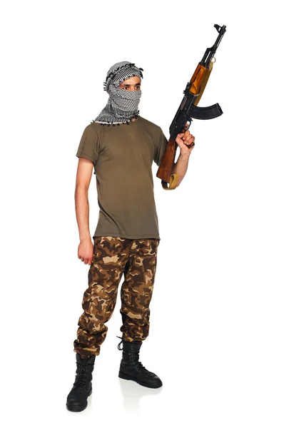 Terrorista com arma automática no fundo branco — Fotografia de Stock