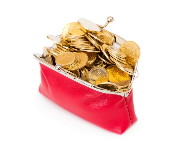 Κόκκινη τσάντα γεμάτη από χρυσά νομίσματα σε ένα λευκό — Φωτογραφία Αρχείου