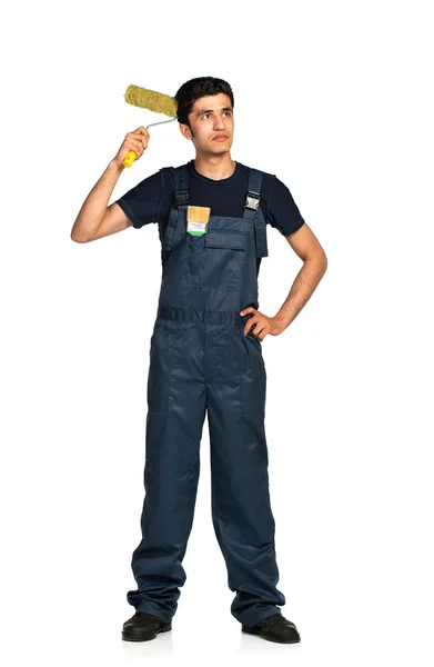 Repairman Arab nationality in the construction overalls on a whi — Stock Photo, Image
