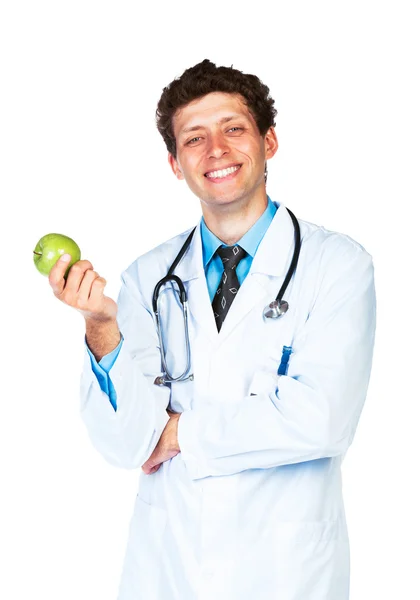 Retrato de un médico varón sonriente sosteniendo manzana verde sobre blanco — Foto de Stock