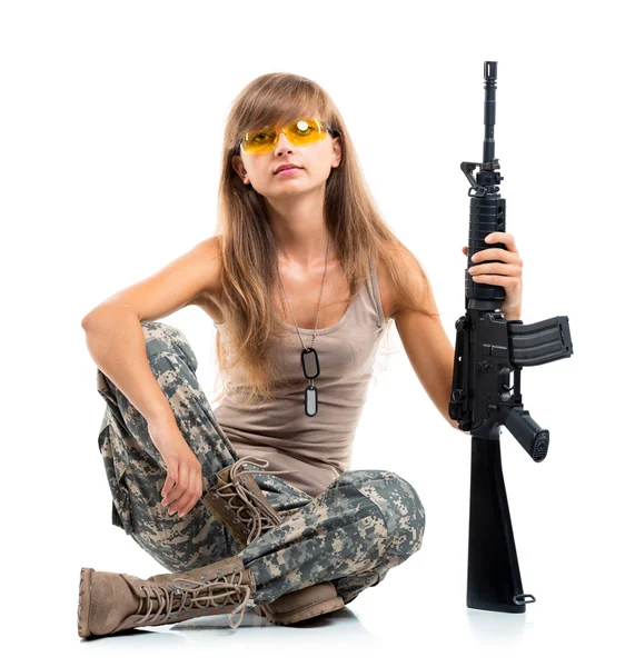 Soldier young beautyful girl dressed in a camouflage with a gun — Stock Photo, Image