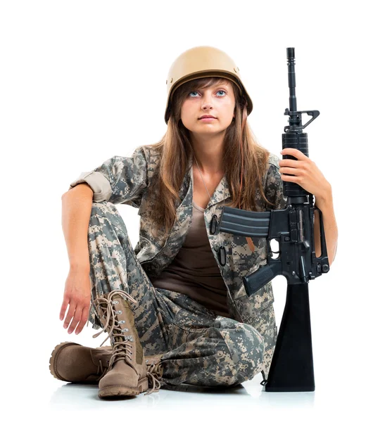 Soldier young beautyful girl dressed in a camouflage with a gun — Stock Photo, Image