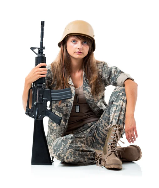 Soldier young beautyful girl dressed in a camouflage with a gun — Stock Photo, Image