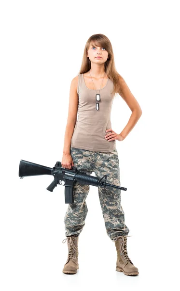 Soldier young beautiful girl dressed in a camouflage with a gun — Stock Photo, Image