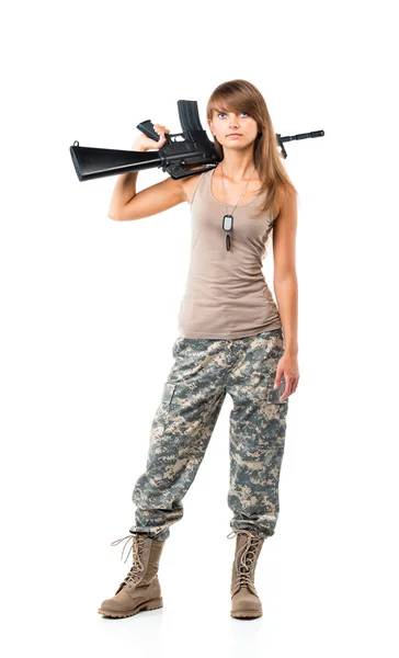 Soldier young beautiful girl dressed in a camouflage with a gun — Stock Photo, Image