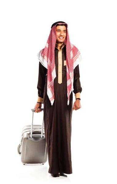 Young smiling arab with a suitcase isolated on white — Stock Photo, Image