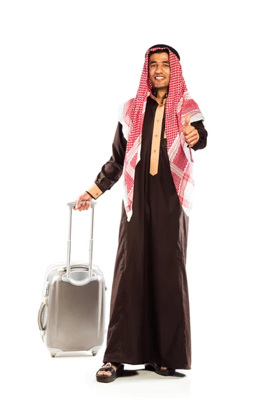 Young smiling arab with a suitcase and thumb up isolated on whit — Stock Photo, Image