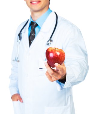 Doktor holding Kırmızı elma beyaz üzerinde gülümseyen