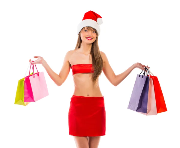 Linda menina de Natal de Santa com sacos de compras em branco — Fotografia de Stock