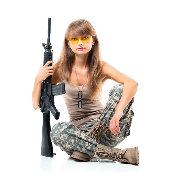 Soldier young beautyful girl dressed in a camouflage with a gun — Stock Photo, Image
