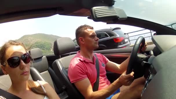 Guy with a girl in a cabriolet — Stock Video