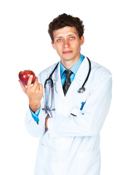 Retrato de un médico varón sosteniendo manzana roja sobre blanco —  Fotos de Stock