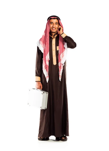 Fiatal, mosolygós arab, egy alumínium eset és cellphone elszigetelt o — Stock Fotó