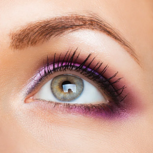 Beautiful womanish eye with glamorous makeup Stock Photo