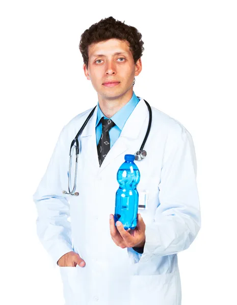 Portrait of a smiling male doctor holding bottle of water on whi — Stock Photo, Image