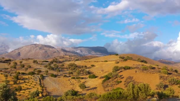 Aerial view of Crete island, Greece. Mountain landscape, olive groves and cloudy sky. — Stock Video