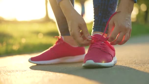 Woman Tying Shoelaces While Jogging Walking Sunset Close Slow Motion — Stock Video