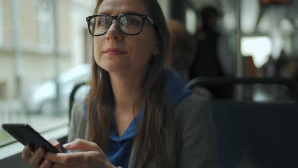 Public Transport Woman Glasses Tram Using Smartphone Chatting Texting Friends — Stockvideo