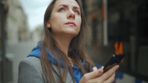 Woman Stands Public Transport Stop Checks Timetable Tram Pulls Background — Vídeo de stock