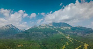 Aerial hyperlapse of the mountain Lomnitsky shield over which clouds float. Beautiful mountain landscape in summer. Tatra Mountains, Slovakia