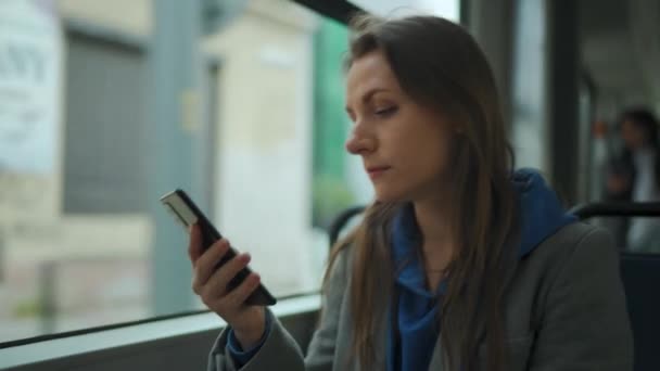 Public Transport Woman Tram Using Smartphone Chatting Texting Friends City — Stockvideo