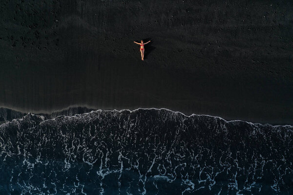 Aerial View Girl Red Swimsuit Lying Black Beach Surf Line Stock Image