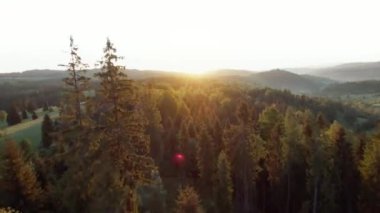 Aerial view of a summer mountain landscape at sunset with rocky peaks on the background. Tatra Mountains, Poland